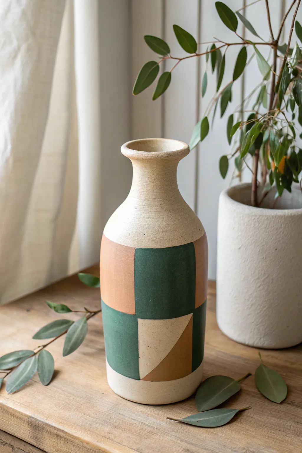 Minimalist geometric color-block vase in earthy tones for a modern Scandinavian boho look