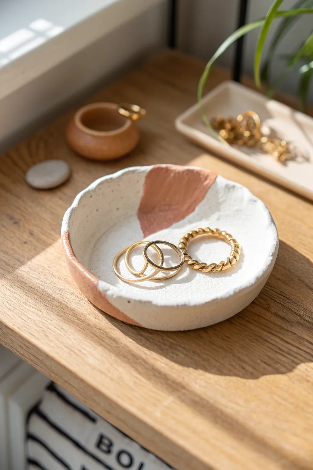 Classic pinch rim trinket dish in two-tone clay, the prettiest spot for rings and clips.