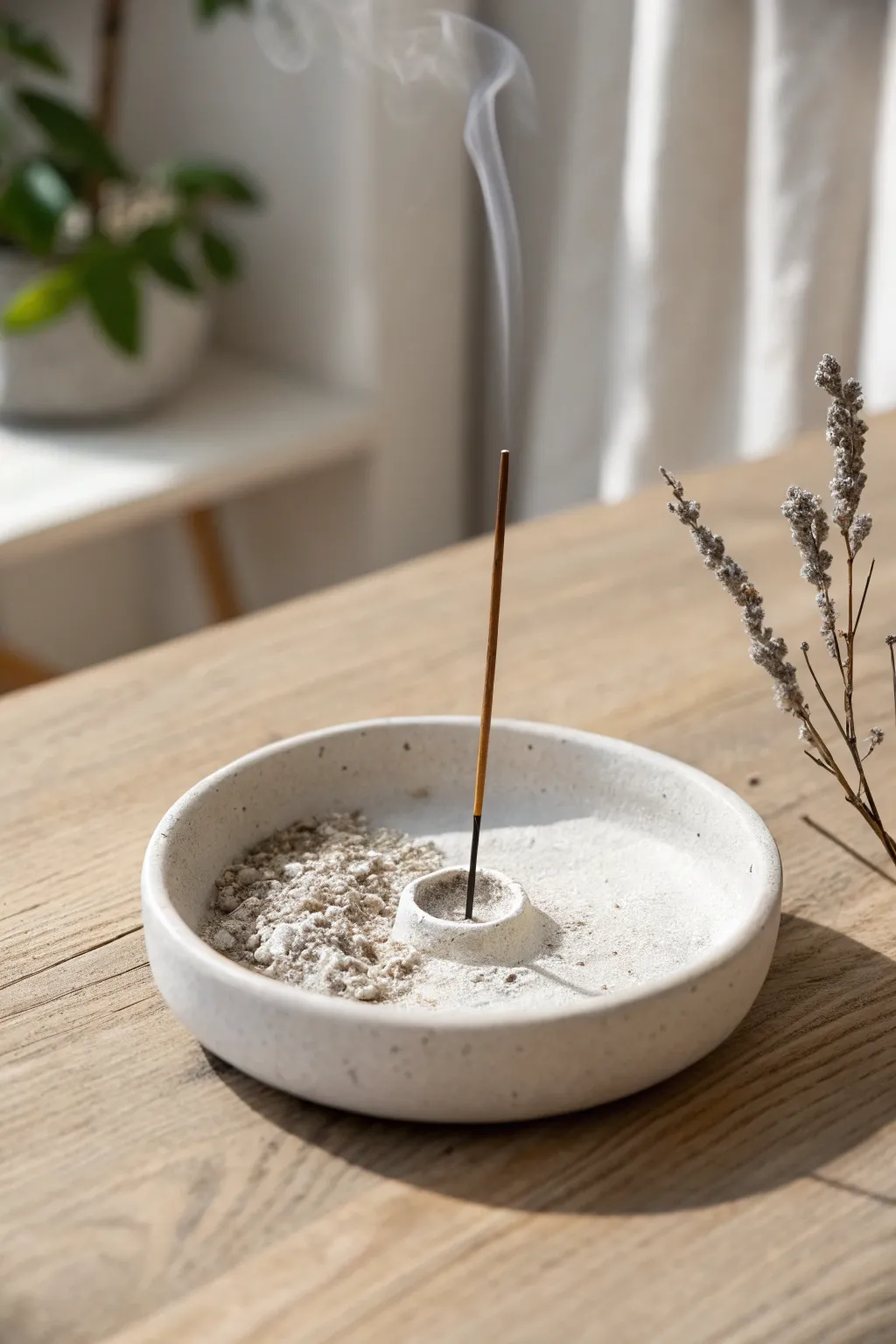Minimalist round clay dish incense holder with angled hole, clean lines, soft ash catch.