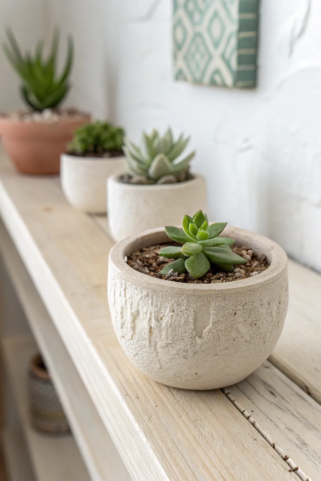 Classic mini pinch pots: simple air-dry clay planters with tiny succulents, styled minimal and cozy.