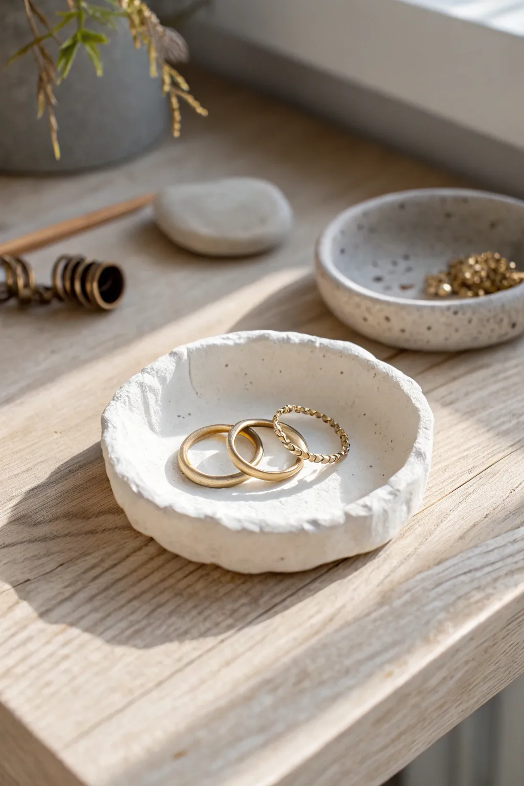 Minimalist air dry clay trinket tray in soft neutrals, perfect for rings and clips.