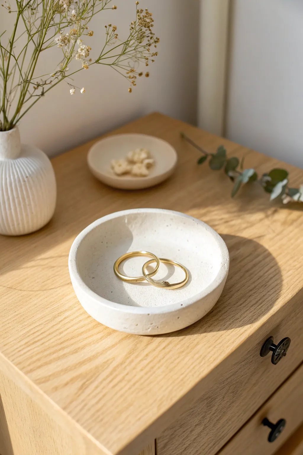 Minimal air-dry clay trinket dish on light wood, perfect for rings and tiny earrings
