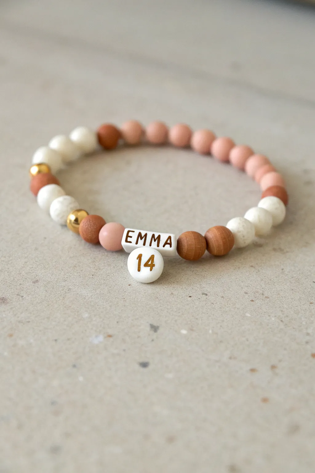 Minimal birthday clay bead bracelet with name and age centerpiece in soft Scandinavian style