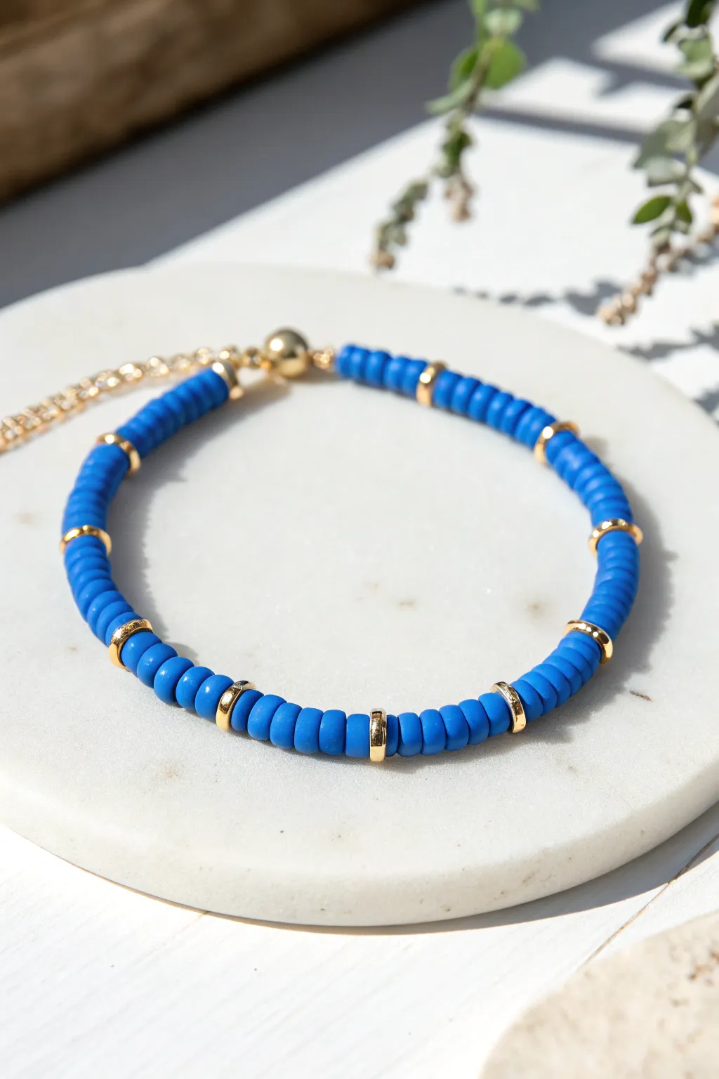 Classic cobalt blue heishi bracelet elevated with evenly spaced gold spacers for a clean, luxe look.