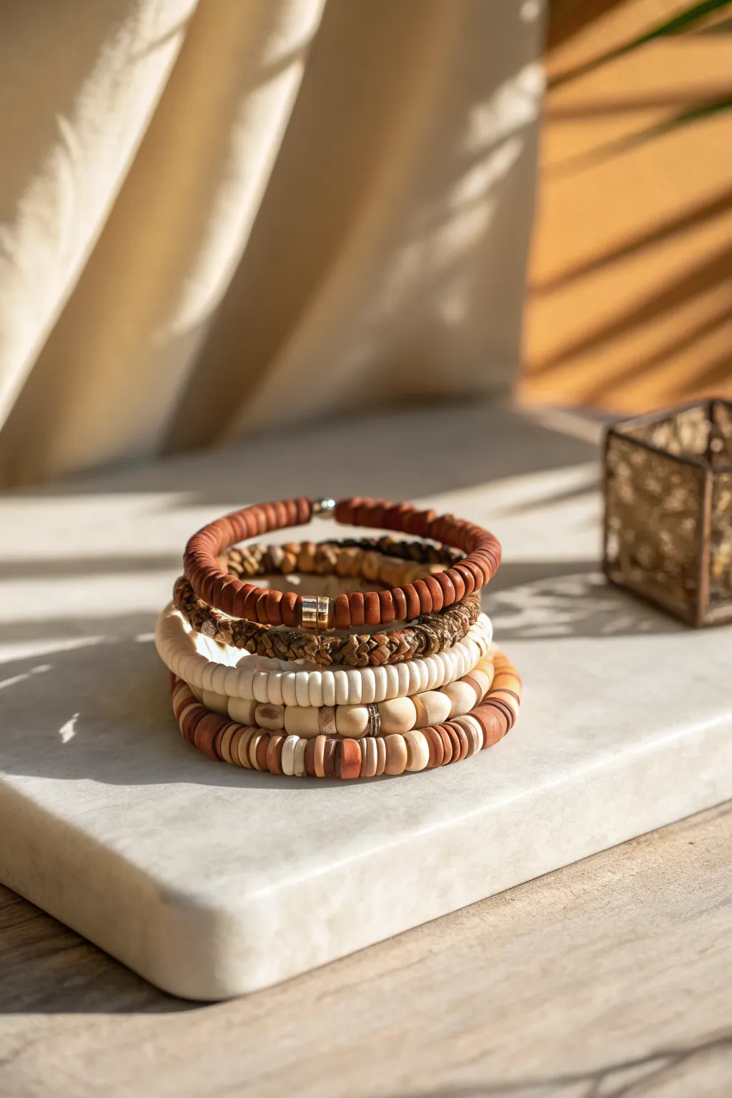 Classic earth-tone heishi stack in matte clay beads, cozy neutrals with subtle strand variation