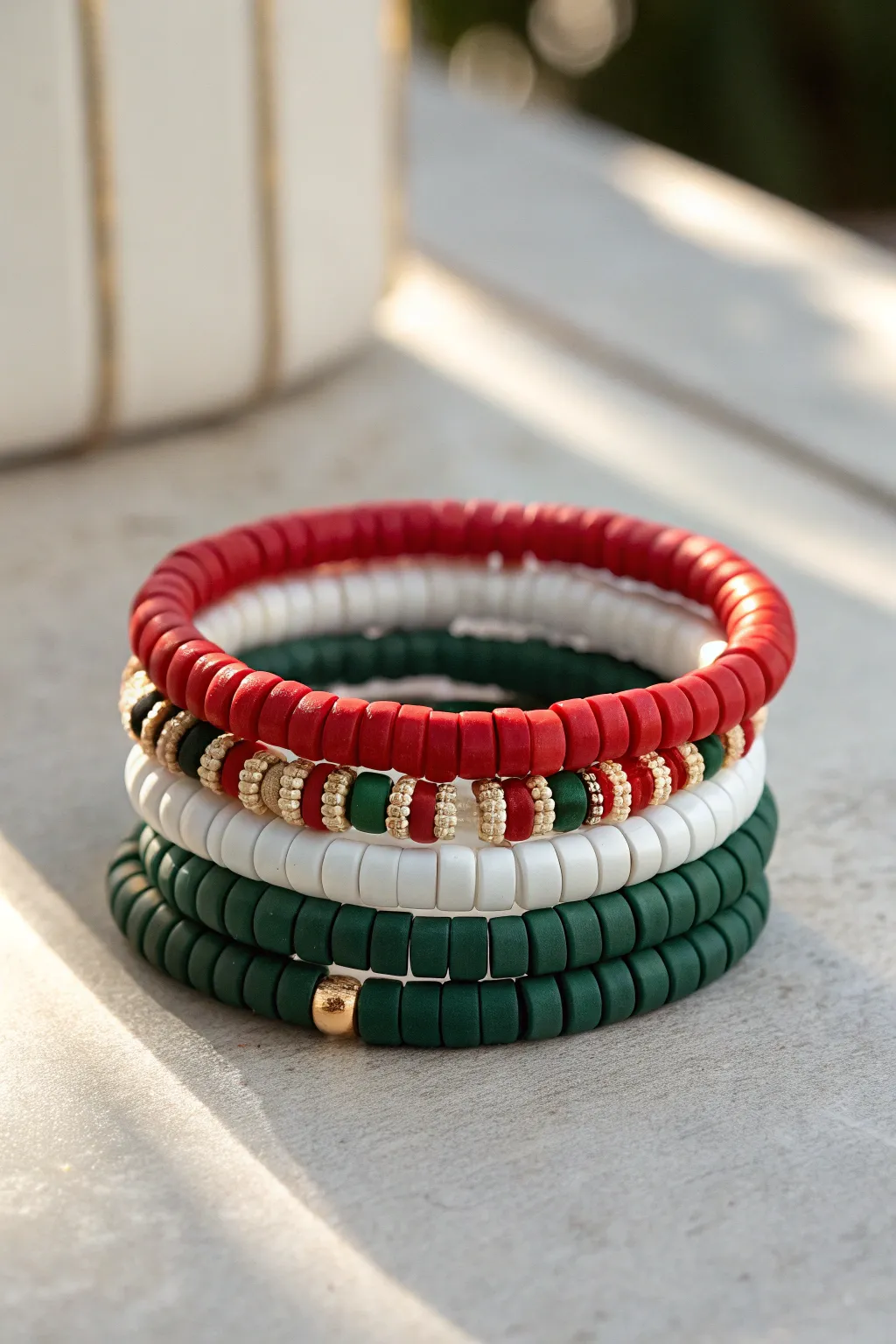 Classic red, white, and green clay heishi bracelet stack for a minimalist Christmas sparkle.