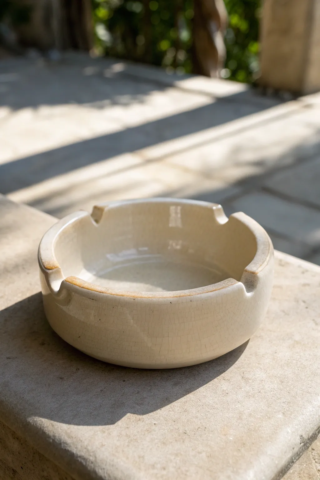 Glossy pinch-pot ashtray with clean U-notches, minimalist and handcrafted for a calm, modern look