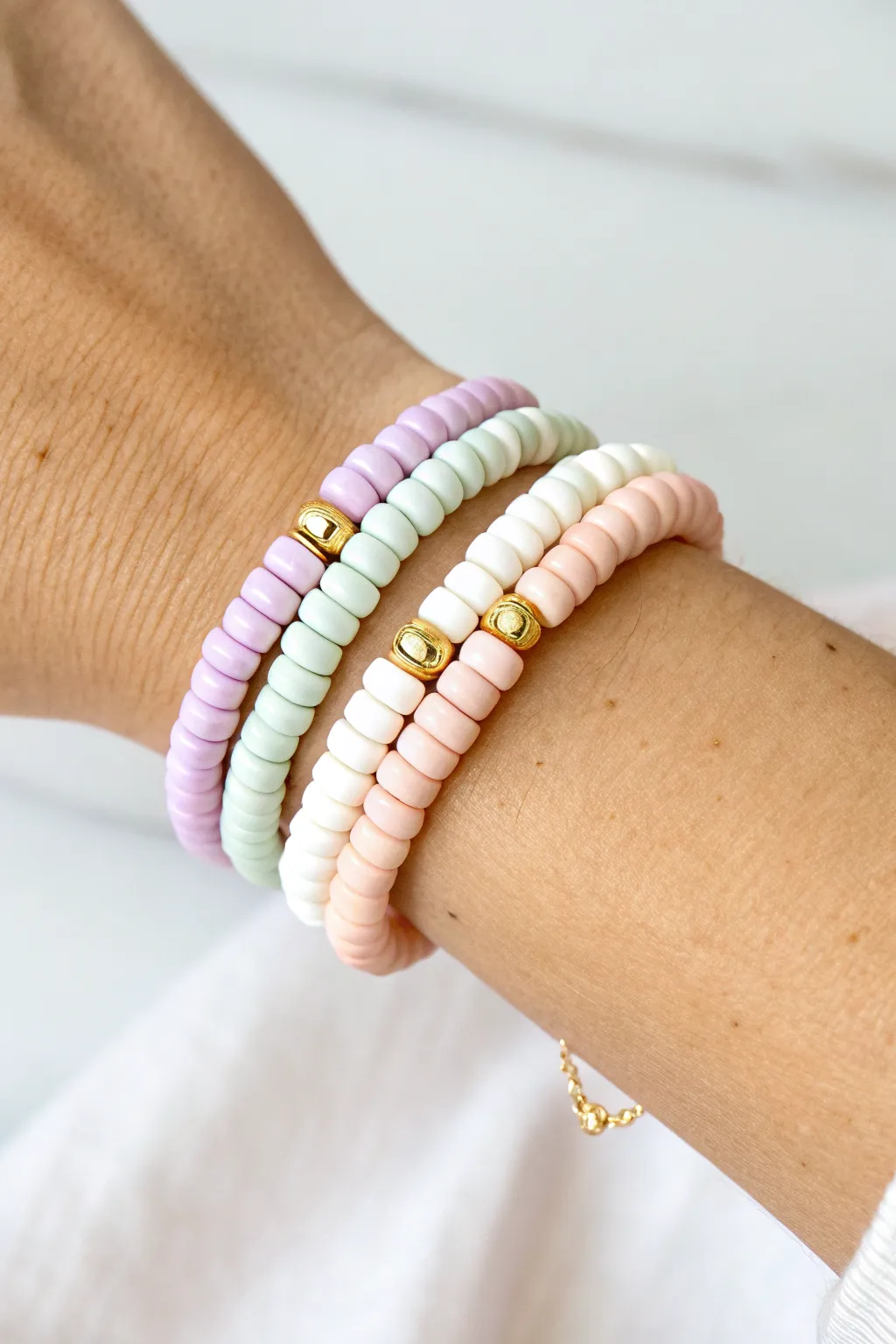 Pastel color-block heishi clay bead bracelet stack for an easy, feminine minimalist look