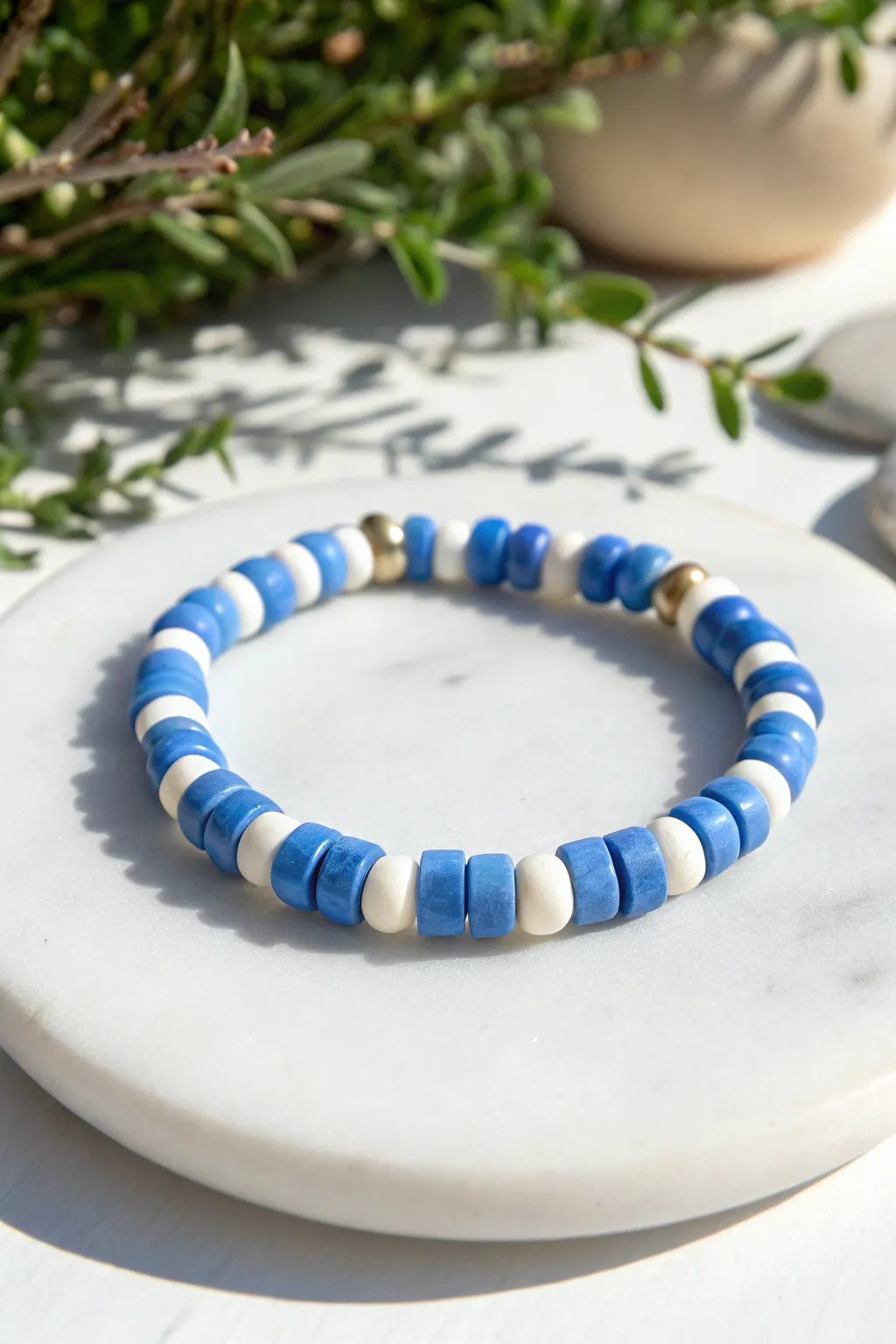 Classic blue and white alternating heishi bracelet with crisp contrast and minimalist charm