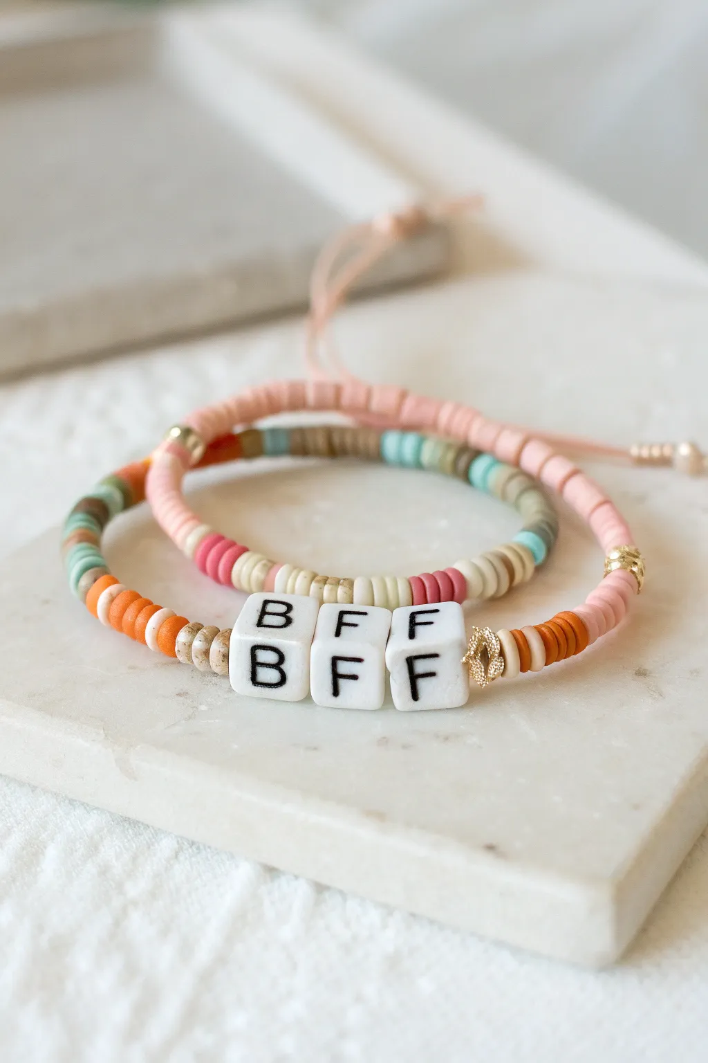 Minimal pastel heishi bead bracelets with a simple BFF centerpiece, made for matching besties