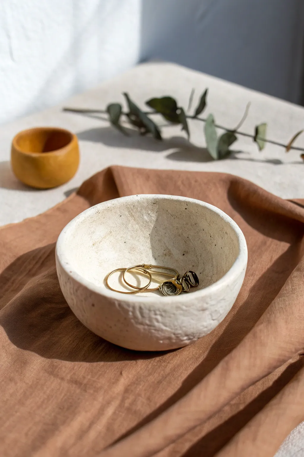 Minimal pinch pot trinket dish with soft thumb marks, perfect for rings and hair pins