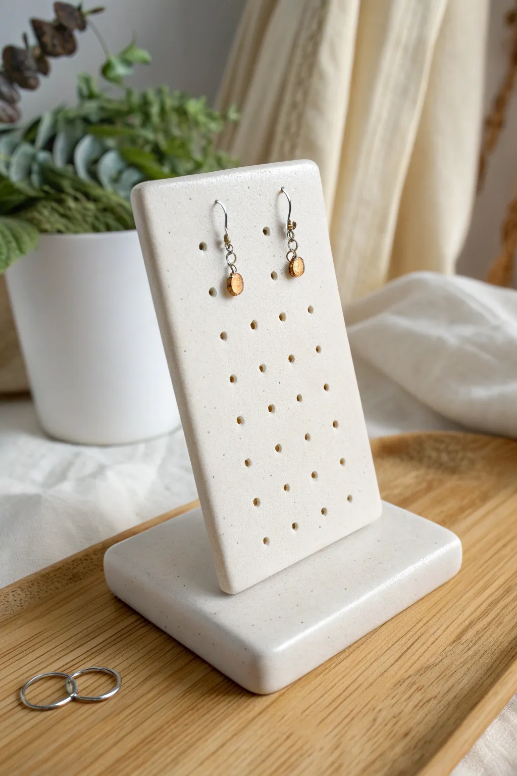 Simple polymer clay slab stand with tidy holes, beautifully holding your favorite stud earrings.
