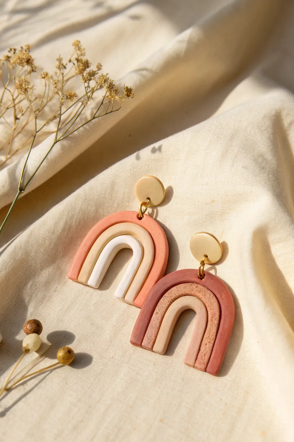 Classic rainbow arch clay dangles in warm neutrals, minimalist curves with a soft boho vibe