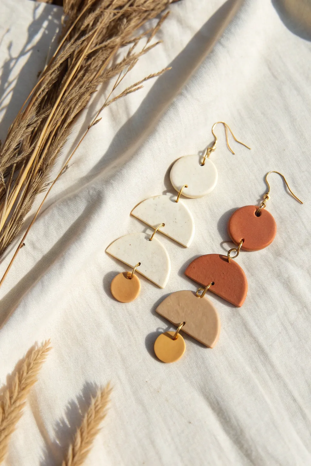 Classic geometric clay dangles in neutral tones, minimalist and handmade with a soft boho feel