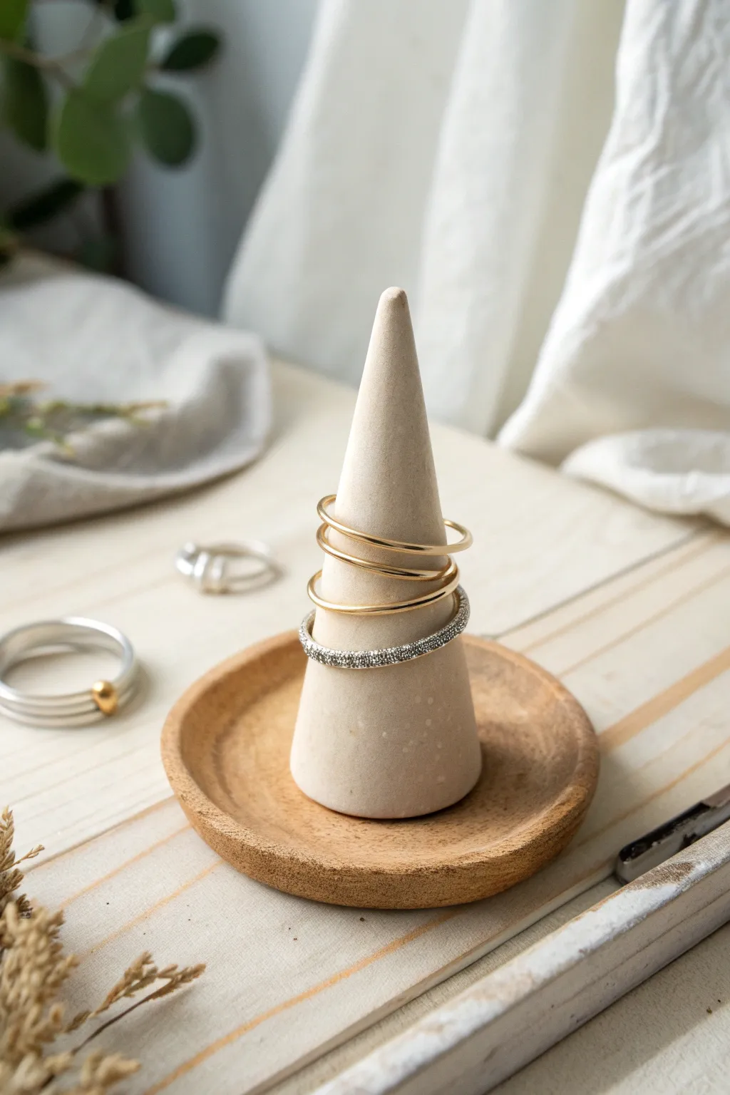 Classic cone clay ring holder in soft blush, a minimalist way to keep rings tidy and pretty.