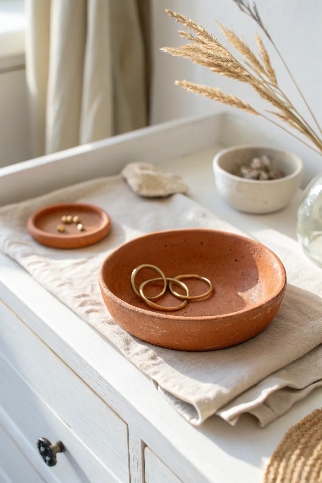 Minimal clay trinket dish in soft neutrals, perfect for rings and earrings on your dresser