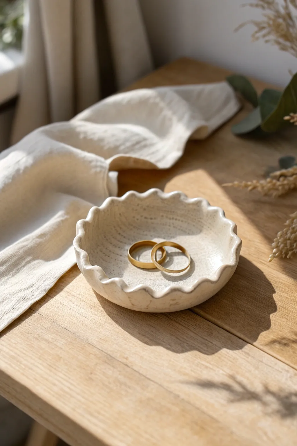 Minimalist wavy trinket dish in matte neutral clay, a calm boho accent for rings and keepsakes.