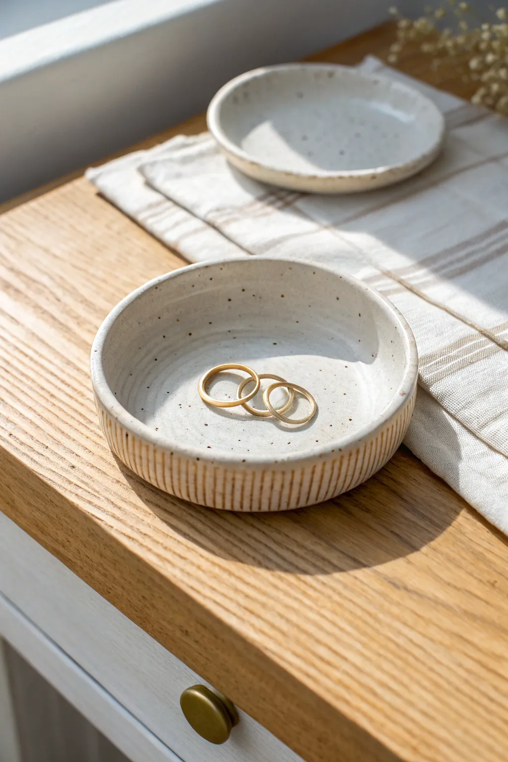 Minimal stamped clay trinket dish to keep rings and pins tidy in a calm, airy vanity moment