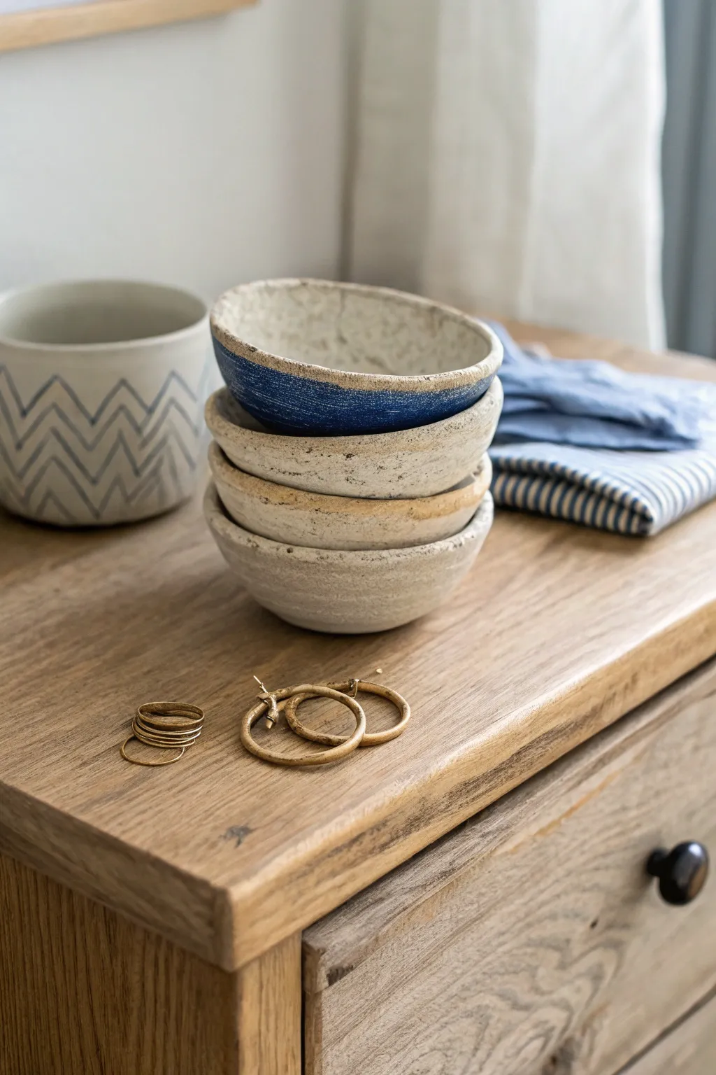 Neutral pinch pot trinket bowls with one bold pop, perfect for rings and hair ties.