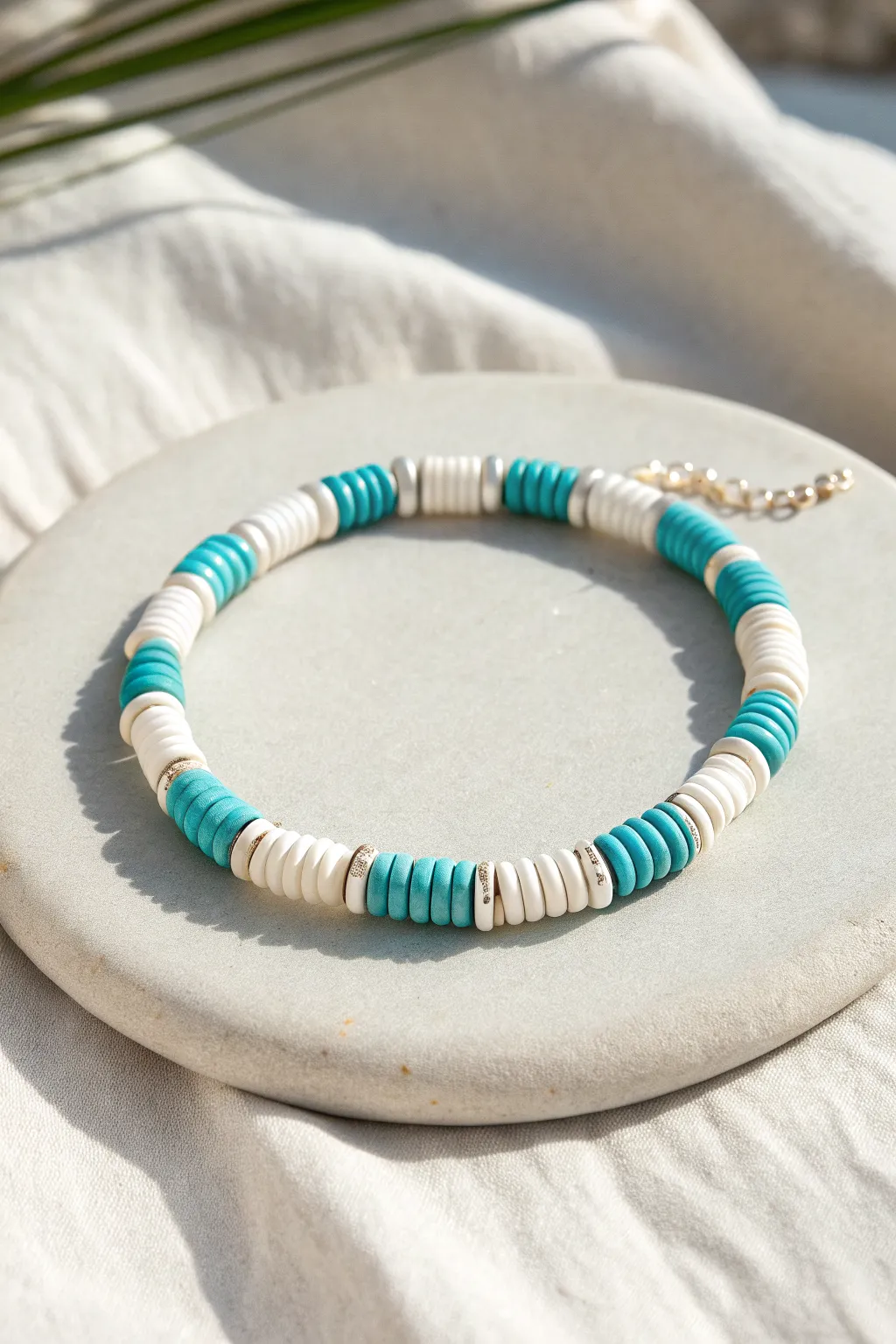 Classic turquoise and white clay disc bracelet on sandy linen, minimalist beachy and handmade