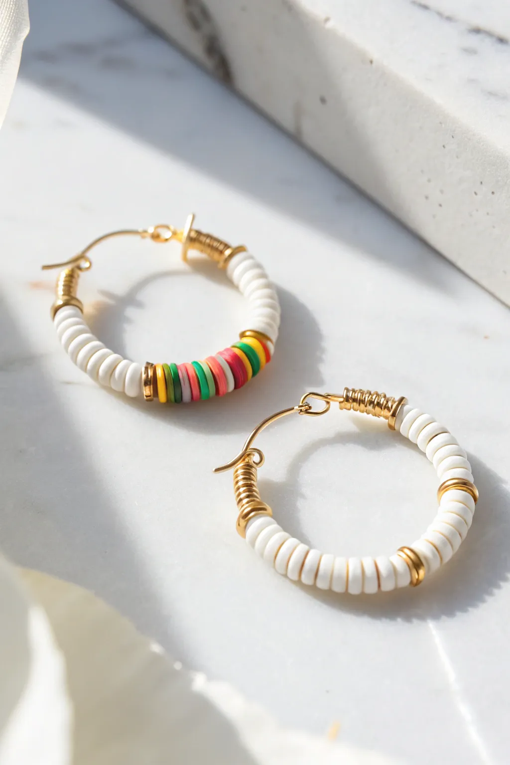 Classic rainbow heishi hoop earring, simple and joyful color stack with clean minimalist styling.