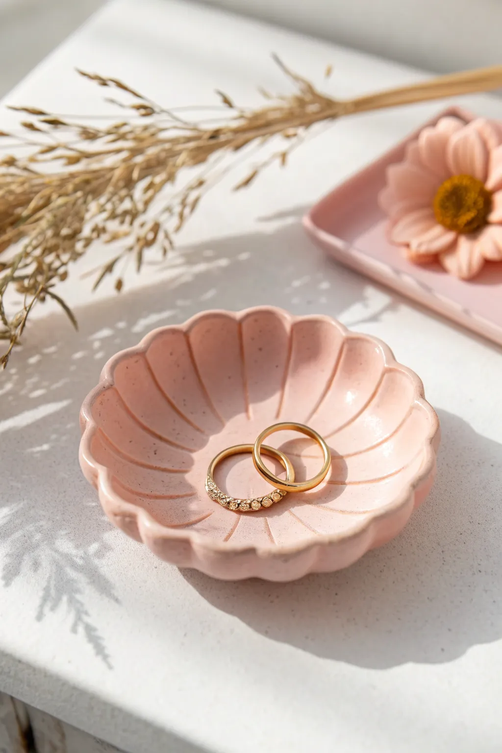Soft scalloped flower-petal ring dish in blush pastel, a sweet minimalist tray idea for jewelry.