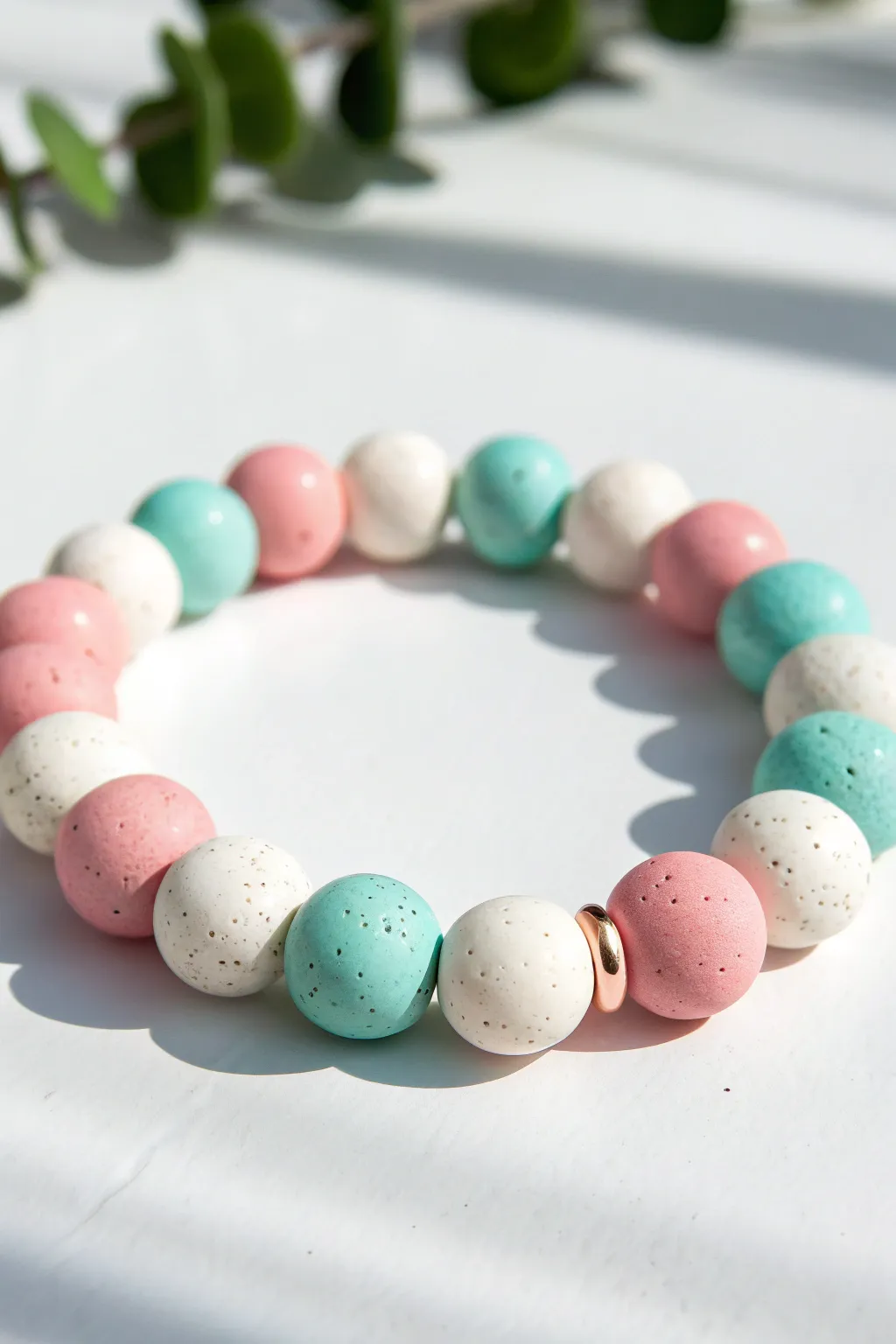 Easy color block clay bead bracelet in pink, white, and turquoise, simple and modern.