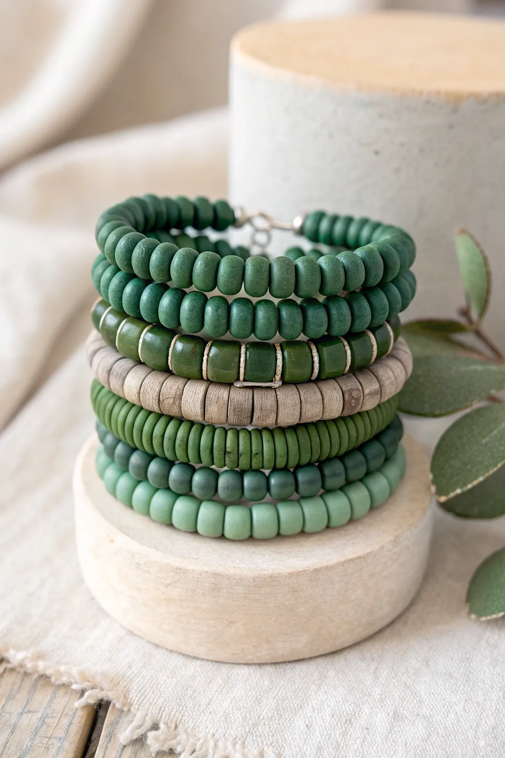 Monochrome green heishi stack from forest to mint for a calm Scandinavian boho look.
