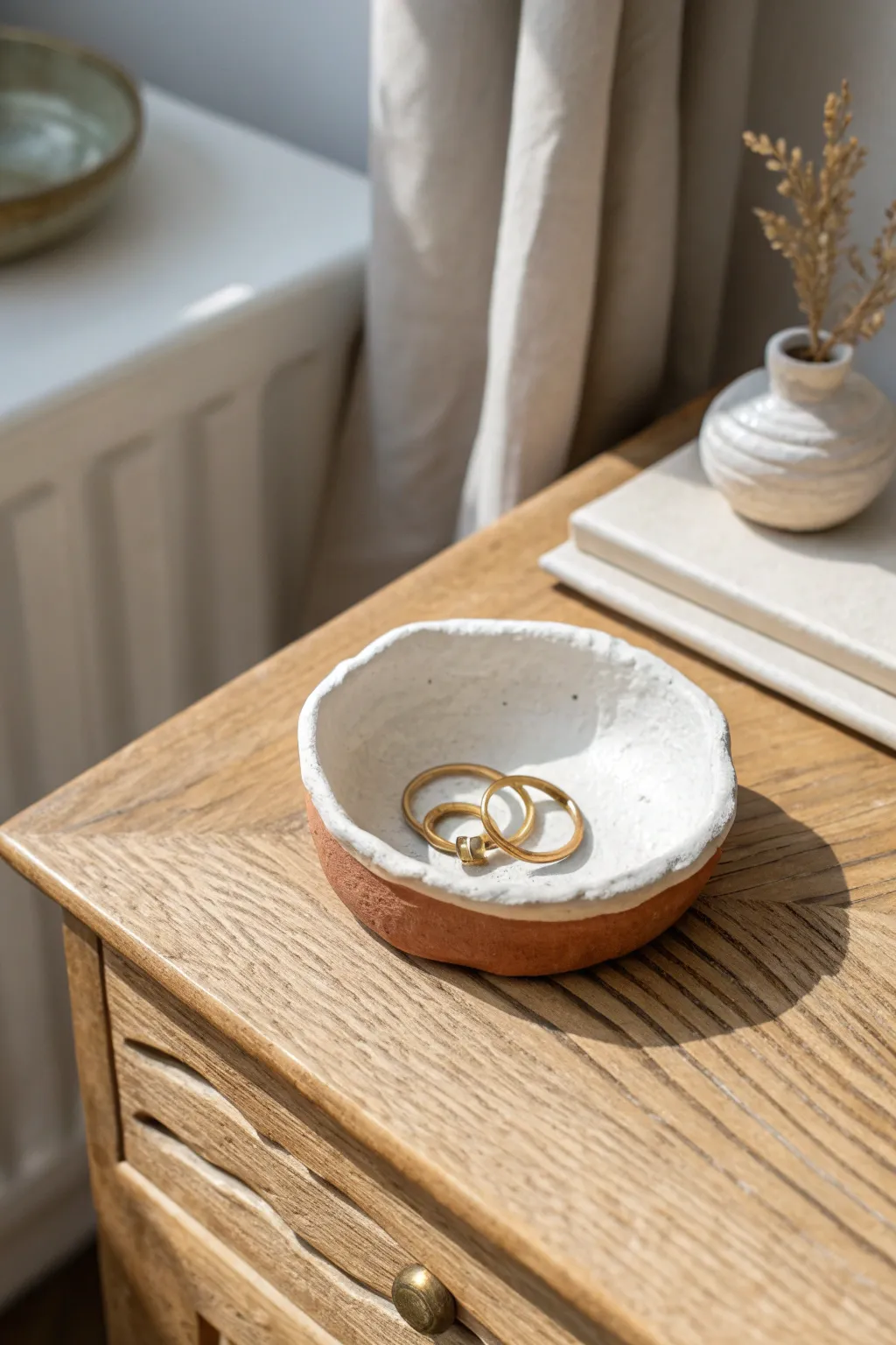 Simple pinch pot trinket dish in two-tone clay, perfect for rings and small nightly treasures.