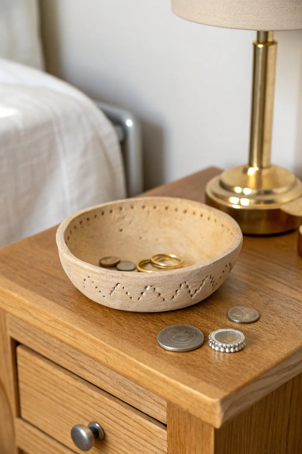 Cozy pinch-pot trinket dish with simple rim texture, perfect for rings and bedside essentials