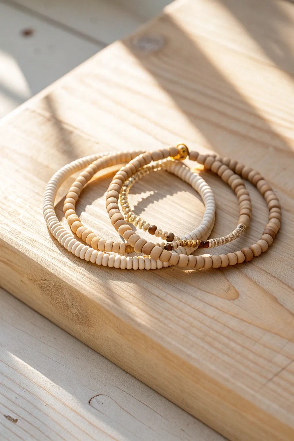 Classic beige heishi bracelet stack in cream, sand, and tan for an effortless neutral look.