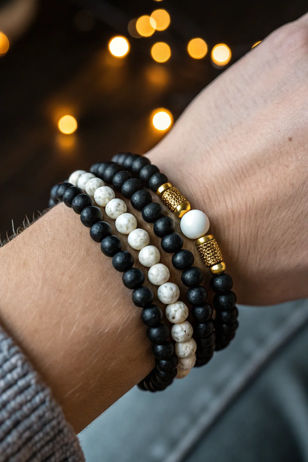 Midnight matte black clay beads with gold sparkle and a crisp white accent for New Year glow.