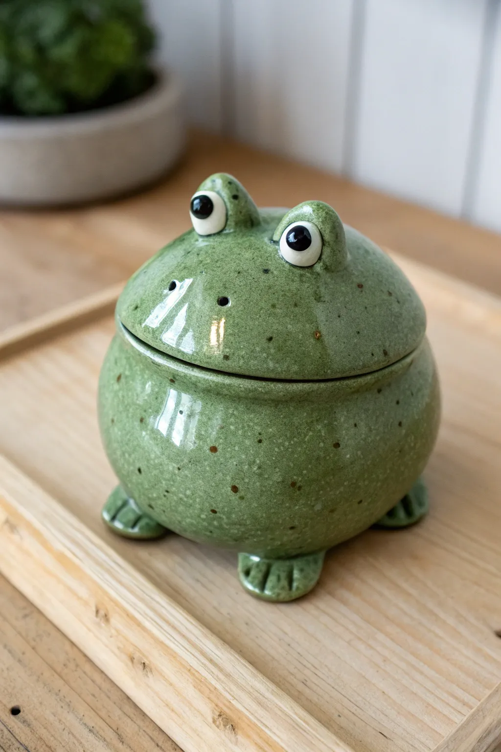 Classic round frog pinch pot rattle, chubby and cheerful, perfect for a simple handmade gift.