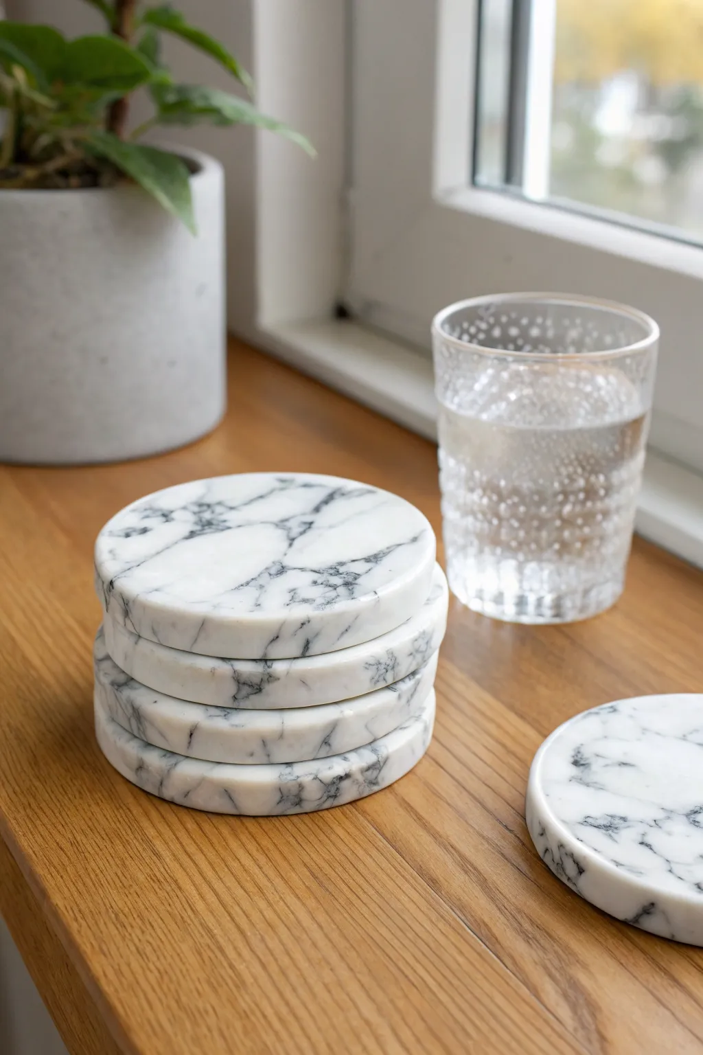 Classic faux marble polymer clay coasters stacked on warm wood, minimalist and handmade.
