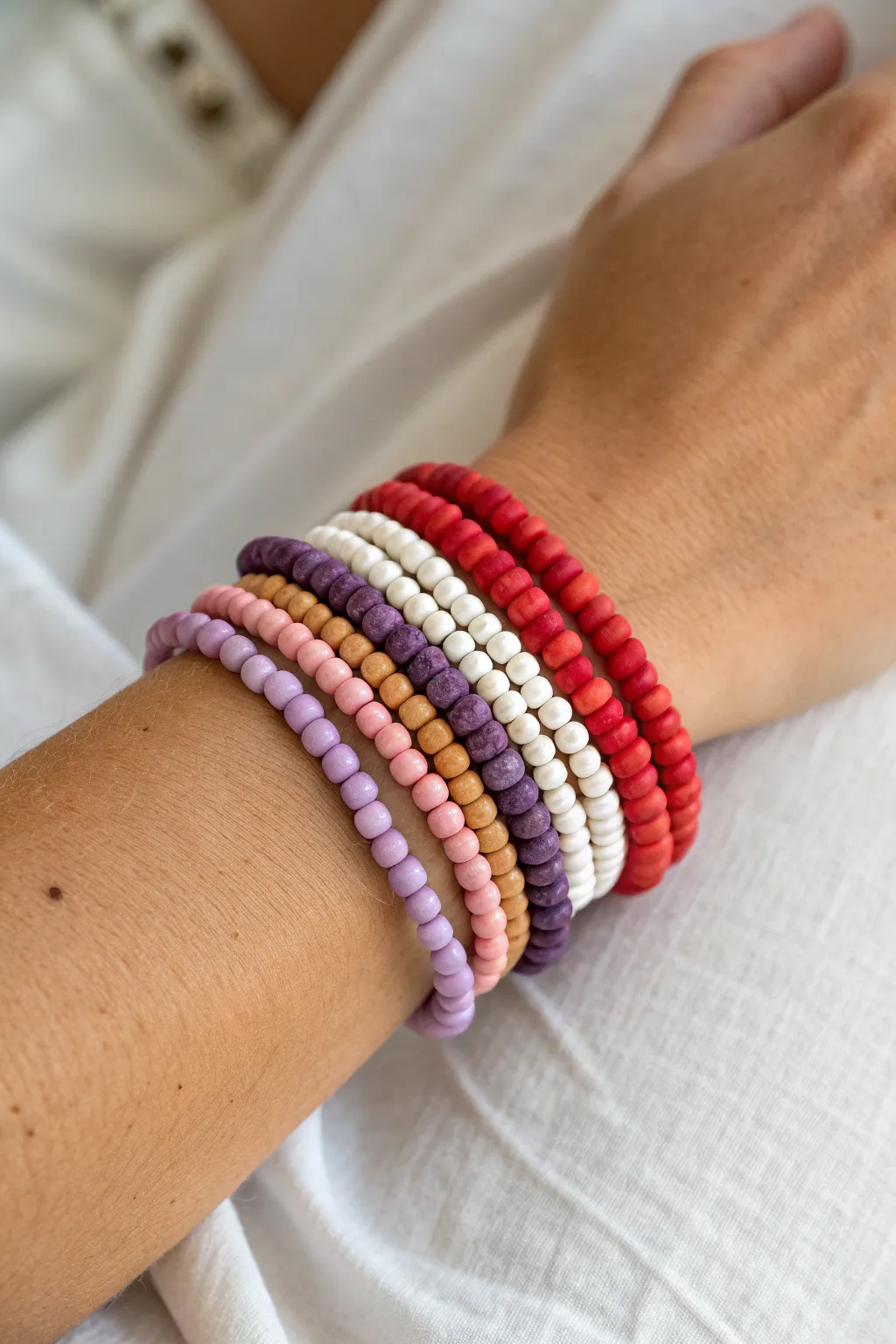 Classic rainbow heishi stack with a crisp white break, minimal and boho-perfect for everyday wear