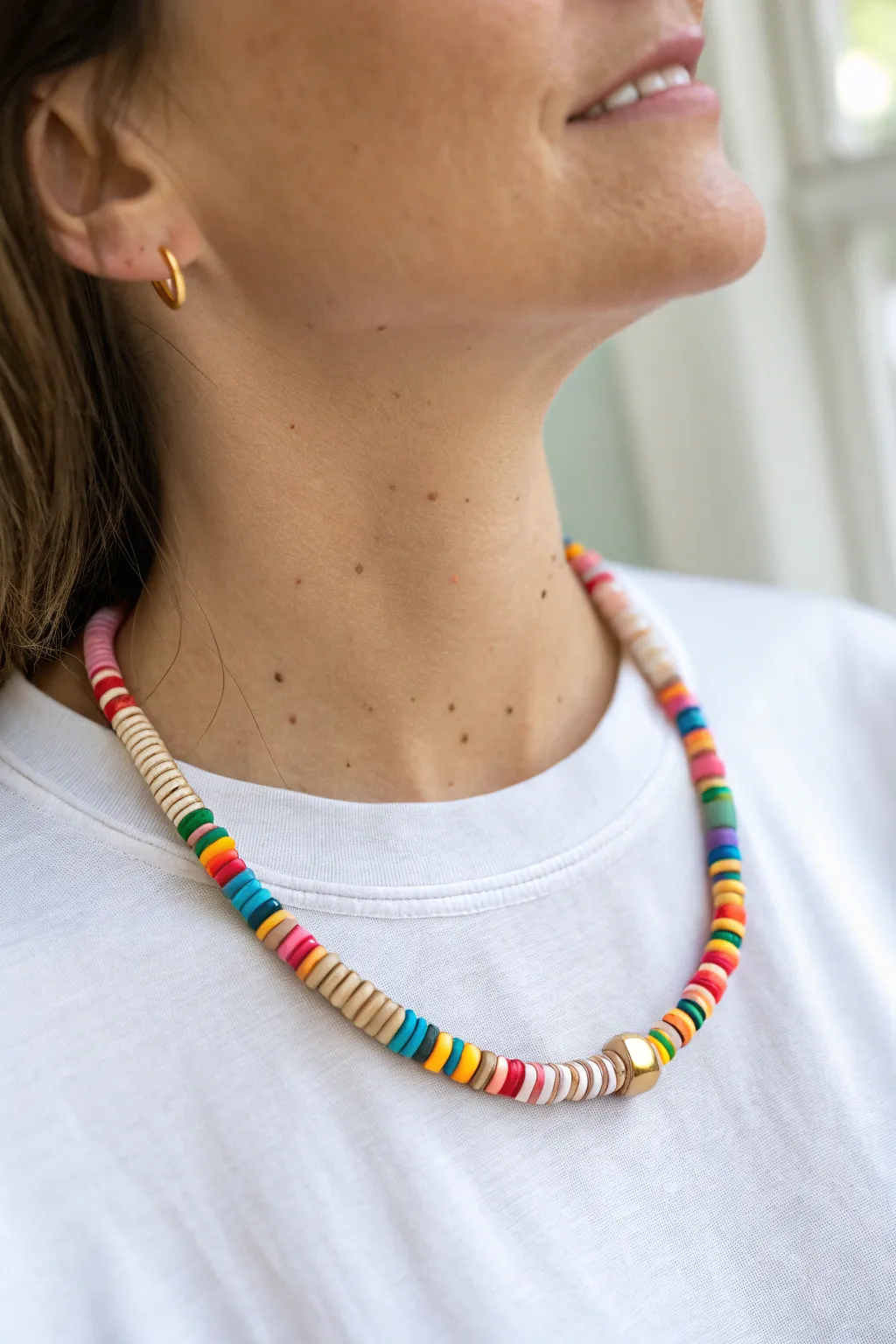 Rainbow heishi choker in crisp clay discs for a preppy pop of color on a clean white tee