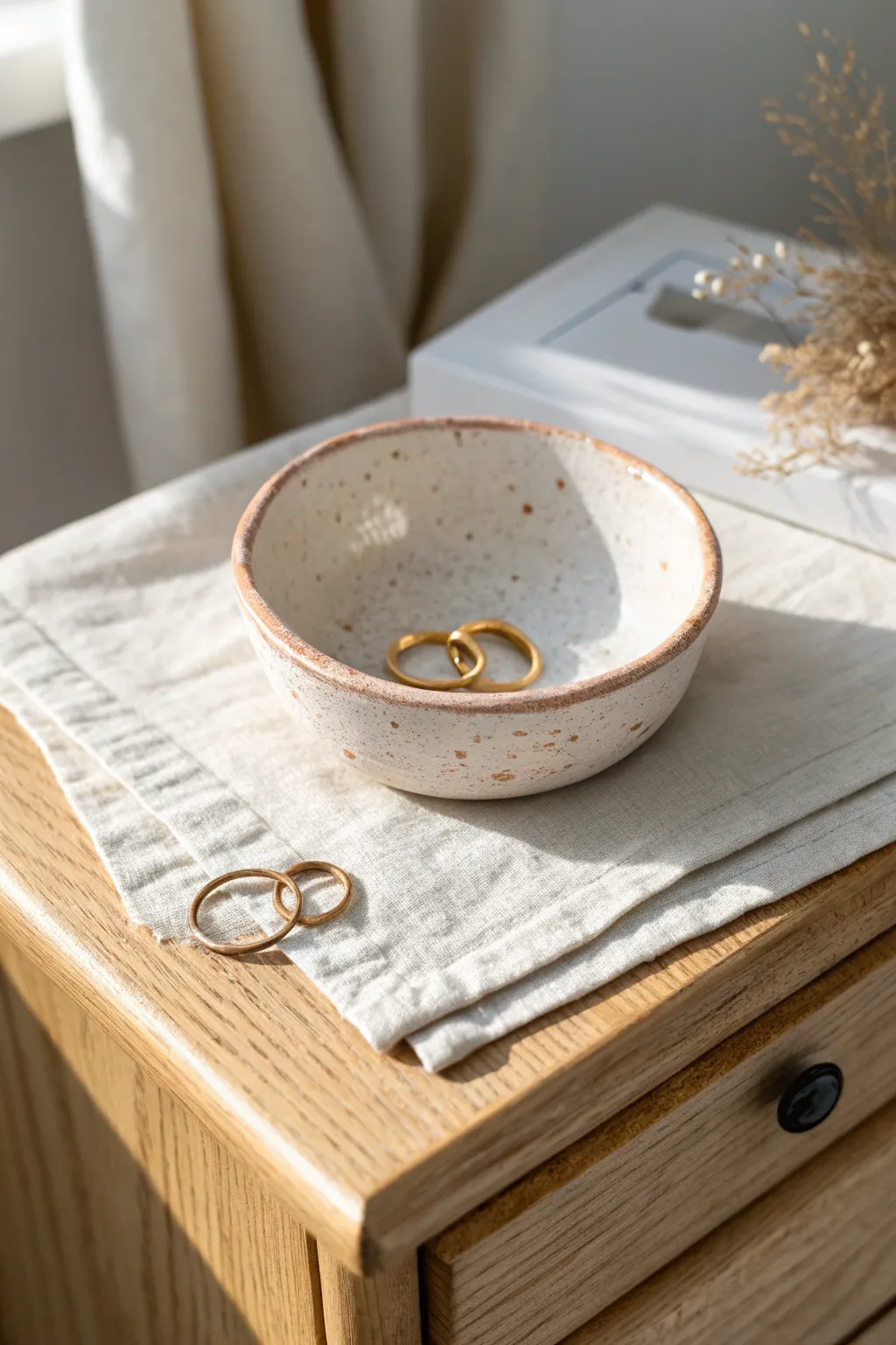 Minimal air-dry clay pinch-pot dish for rings and pins, softly speckled and serene