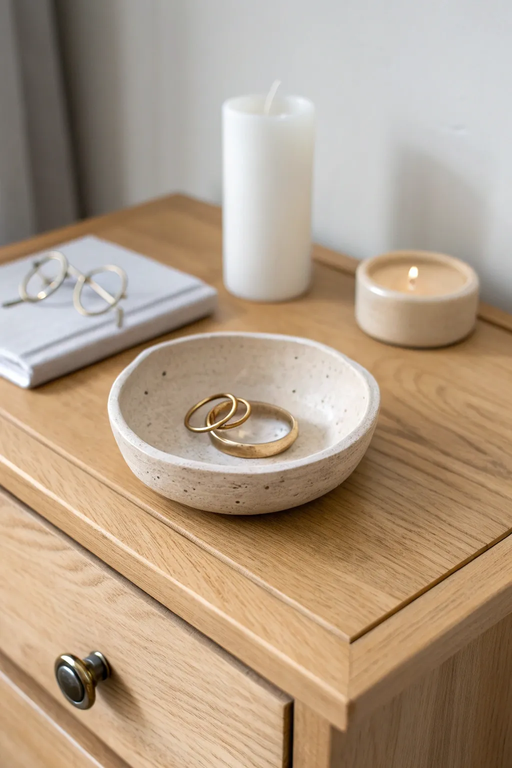 Minimal air-dry clay trinket dish in warm neutrals, a chic bedside home for rings.