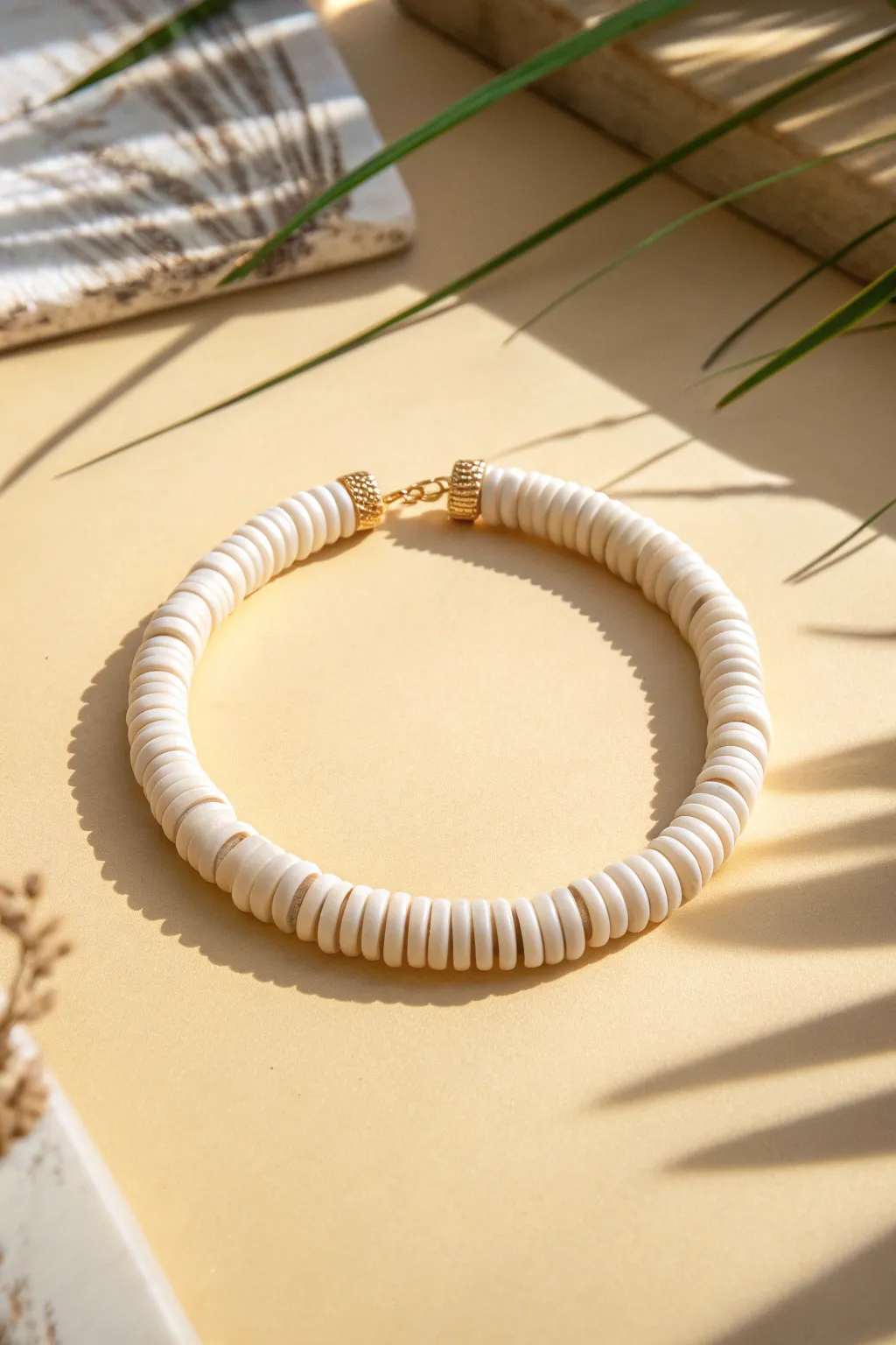 Minimalist solid-color heishi clay bead bracelet, clean flat lay for easy DIY inspiration.