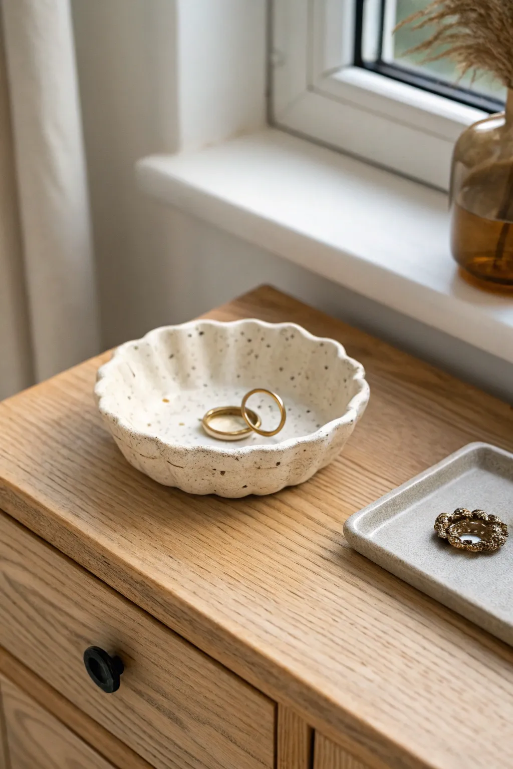 Tiny clay trinket dish keeps rings and pins in one place, minimalist and softly boho.