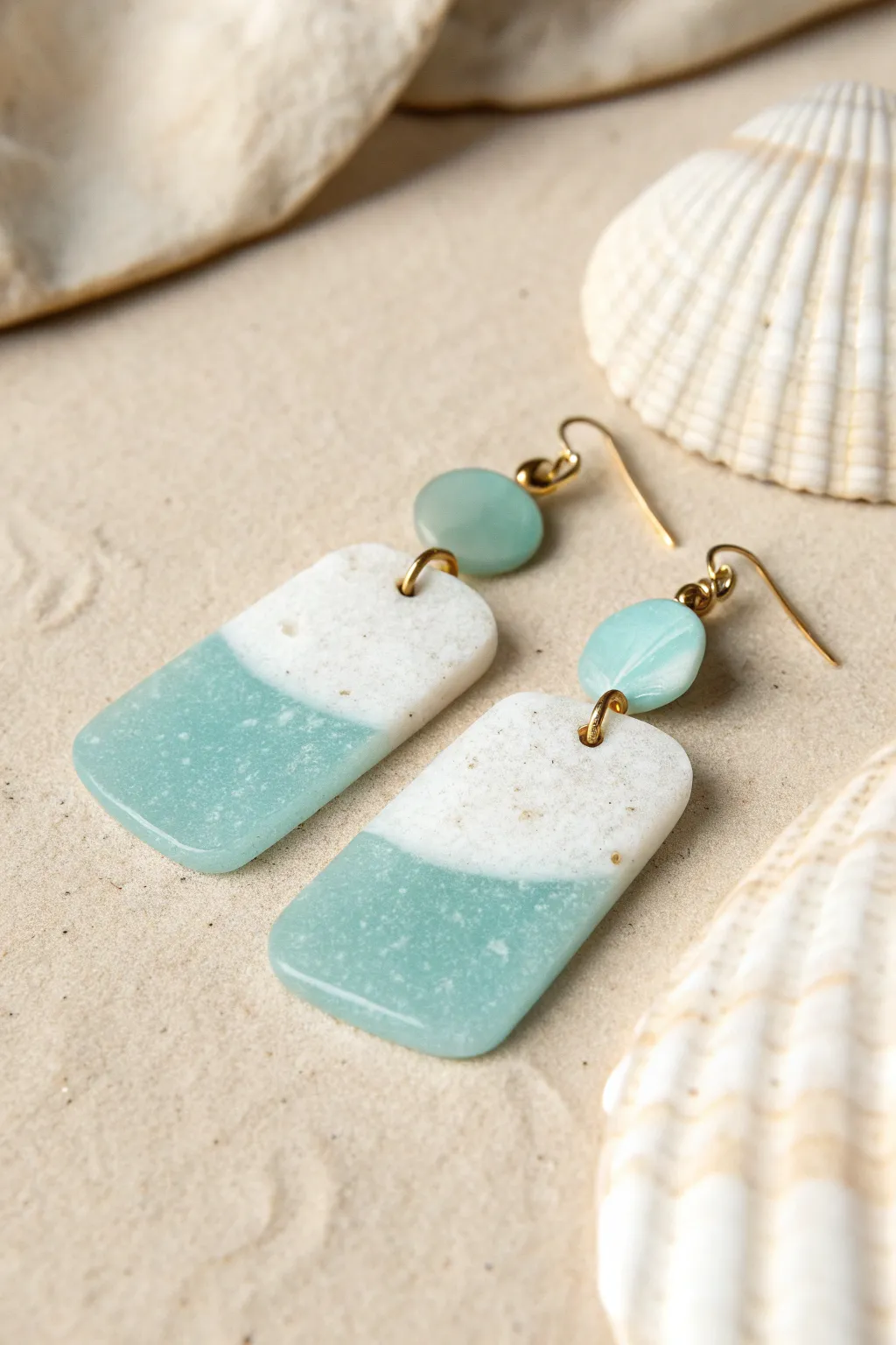 Sea-glass style translucent clay earrings with a soft frosted finish and airy aqua glow