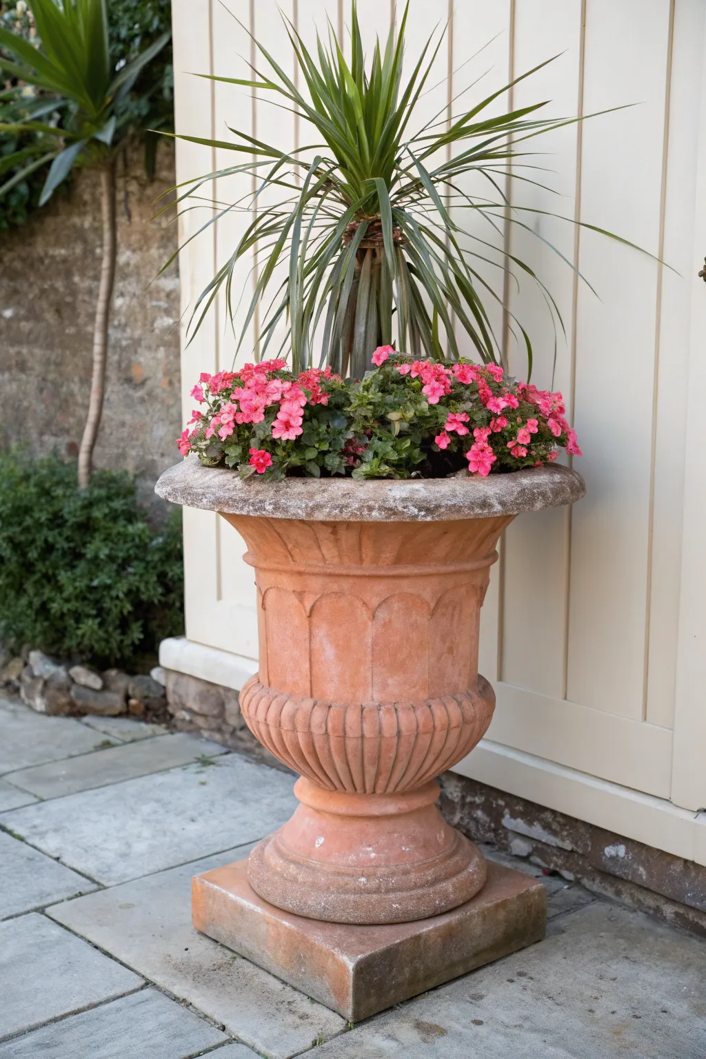 Classic thriller filler spiller urn planter with tall accent blooms and a soft trailing vine