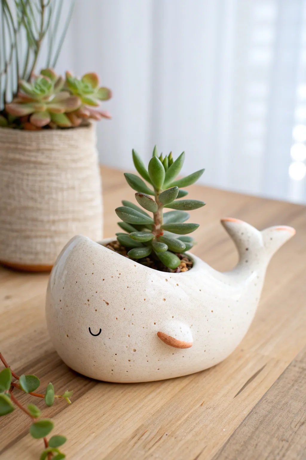 Minimal whale planter with a succulent spout, soft tones and cozy Scandinavian-boho calm
