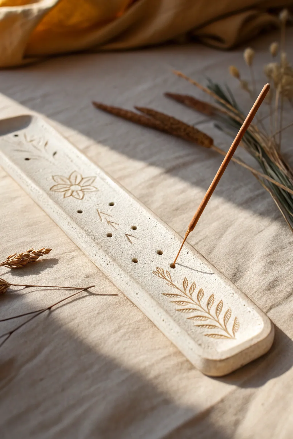 Minimal air-clay incense holder with ash-catching groove and delicate stamped detail