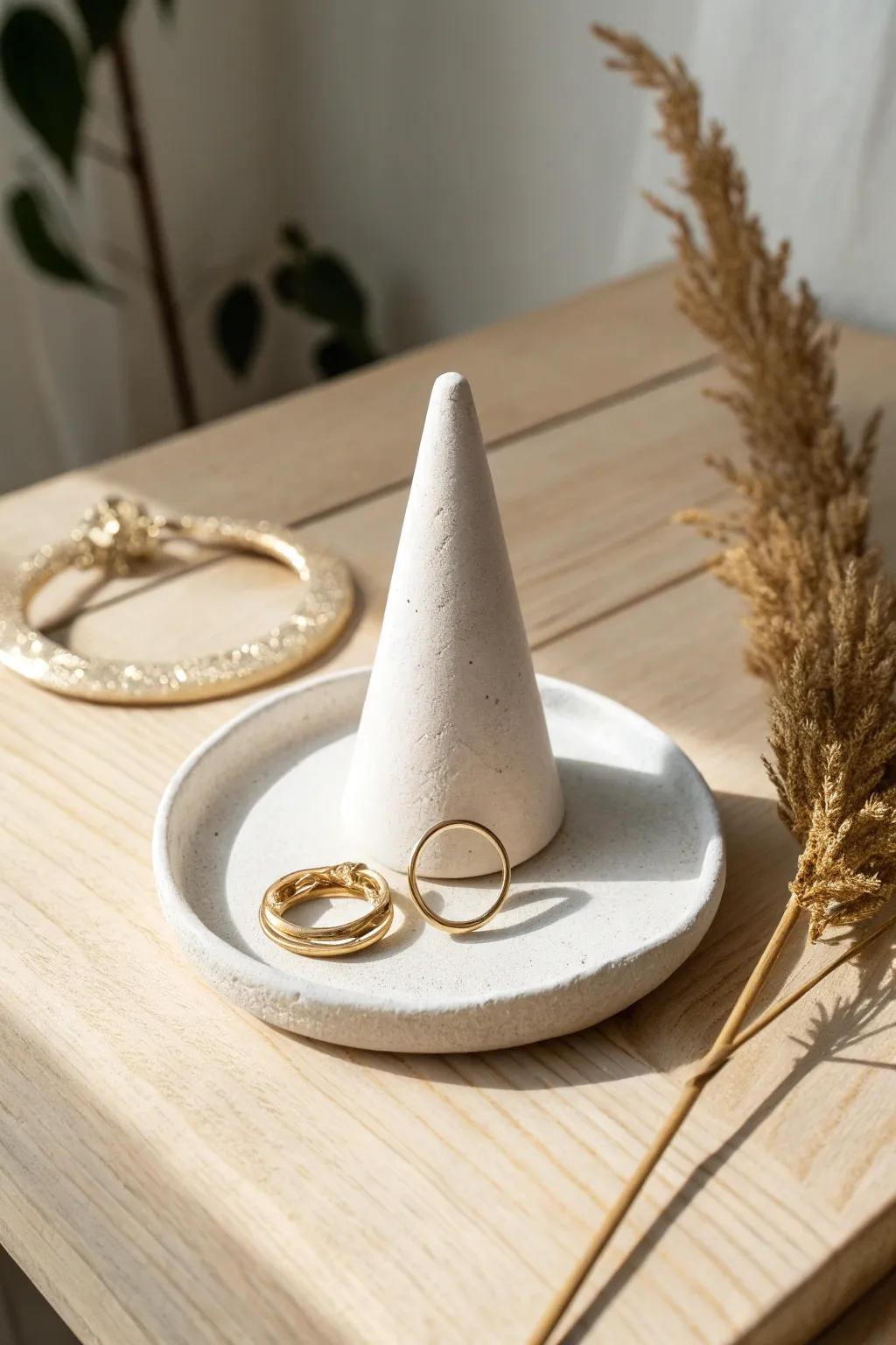 Minimal air dry clay ring holders in matte white and blush for a serene jewelry tray moment.