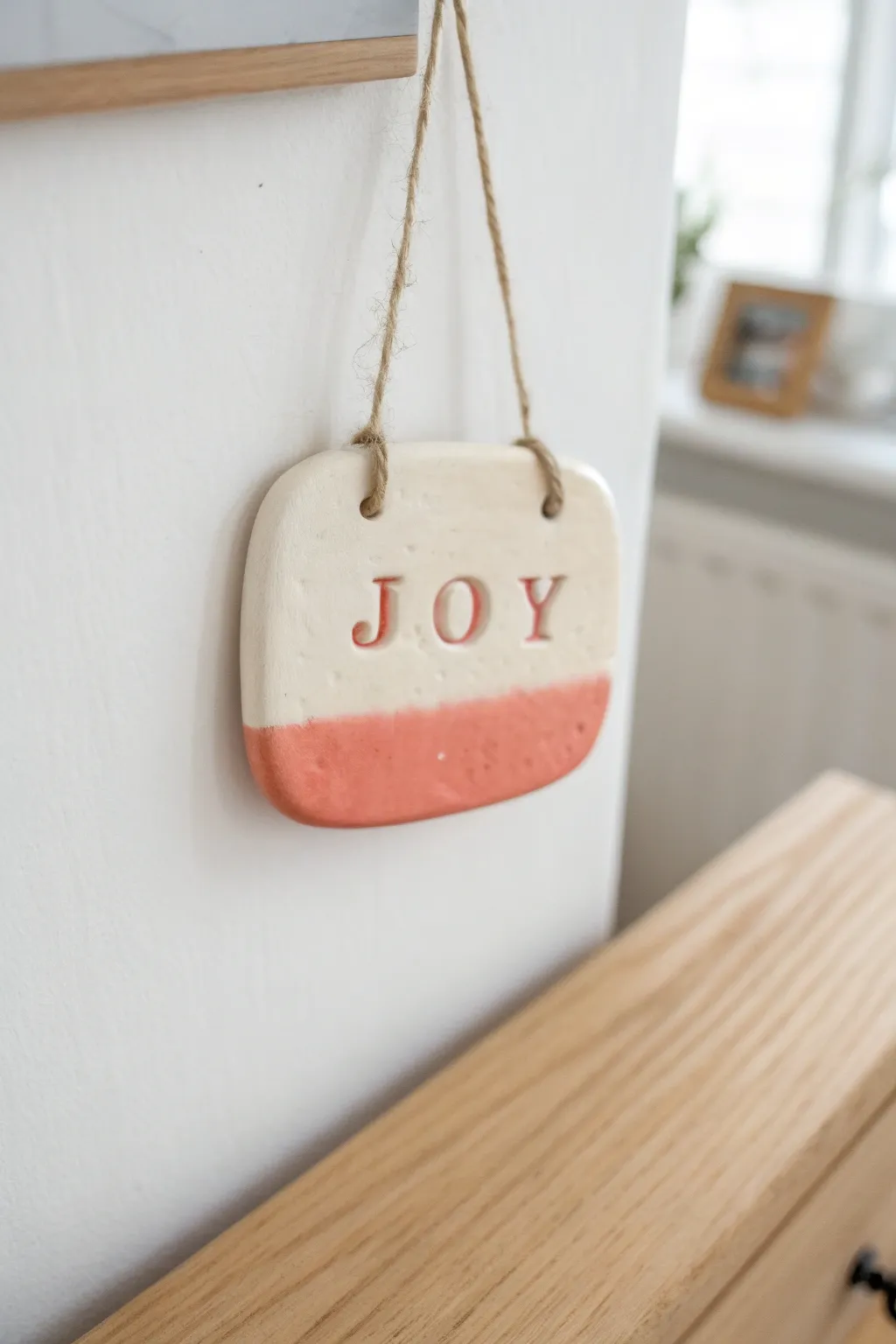 DIY air dry clay wall plaque with raised positive word, perfect for teen desk decor.
