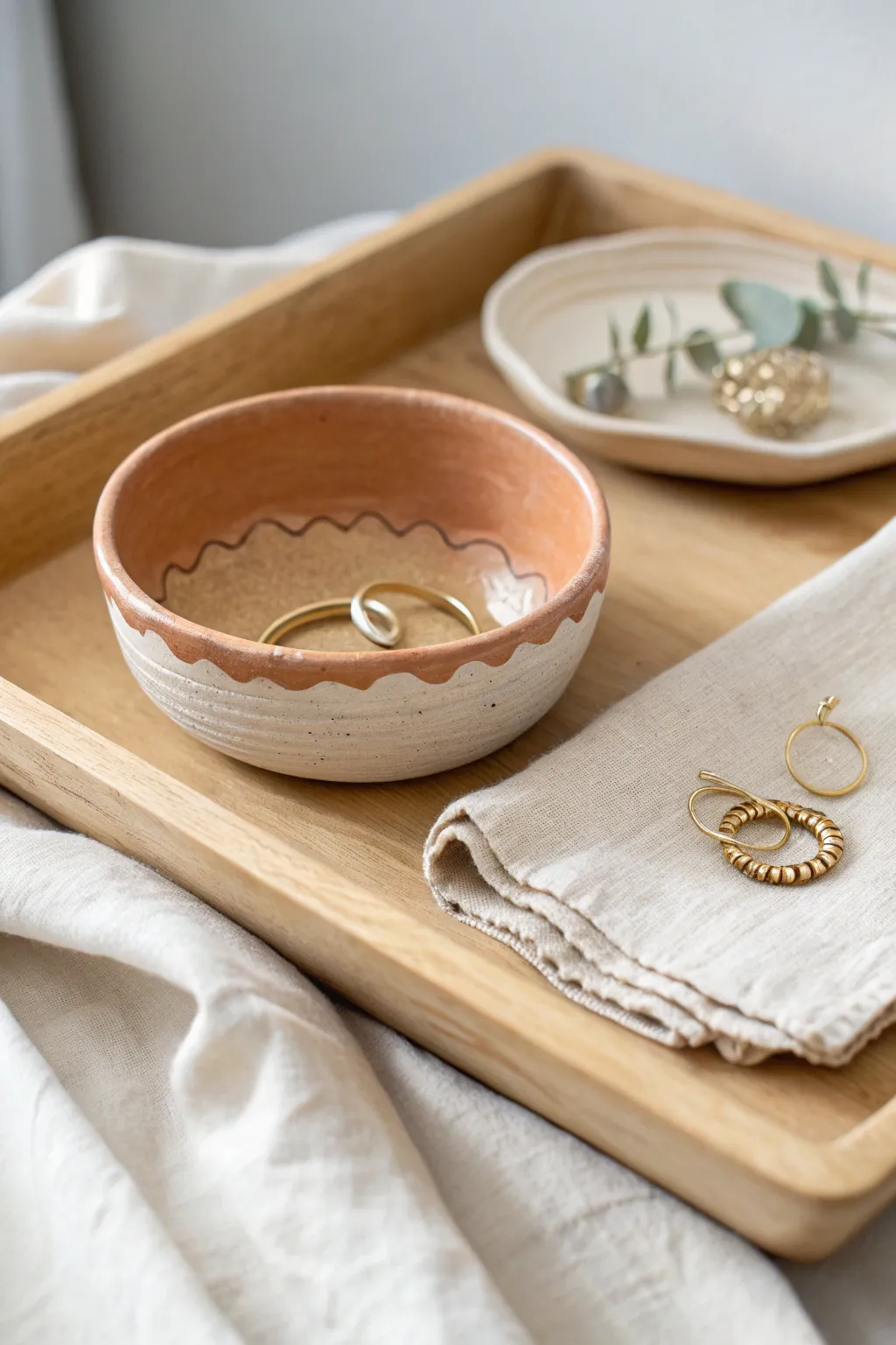 Wavy rim two-tone jewelry catch bowl, an easy air-dry clay DIY that elevates any vanity.