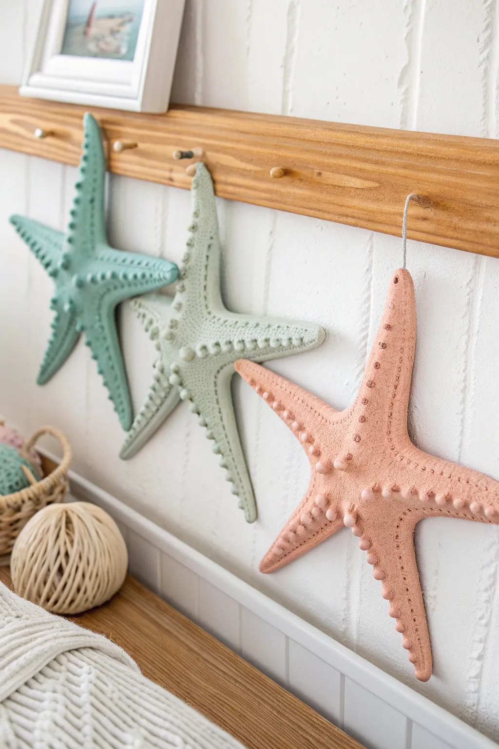Beachy air dry clay starfish wall decor with dotted texture in soft coastal tones.