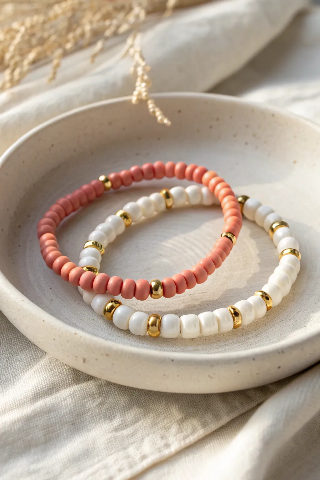 Matching heishi clay bead bracelets with gold spacers, a simple bff gift with polish.