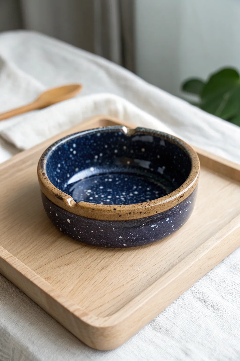 Cosmic reactive glaze ashtray with speckled depth, clean rim rests, and soft minimalist styling
